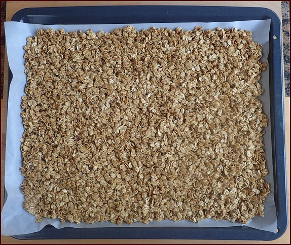 Oven baking homemade granola.