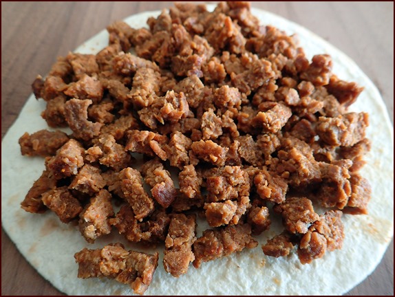 Rehydrated taco-seasoned Beyond Burger on a tortilla.