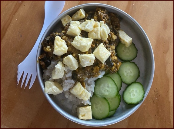 Camp Cashew Curry over Poha, topped with paneer.