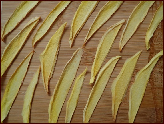 Photo shows dehydrated mango strips.