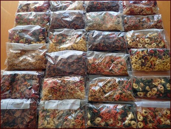 Dehydrated backpacking meals ready for the final step in dehydrated food storage: vacuum sealing.