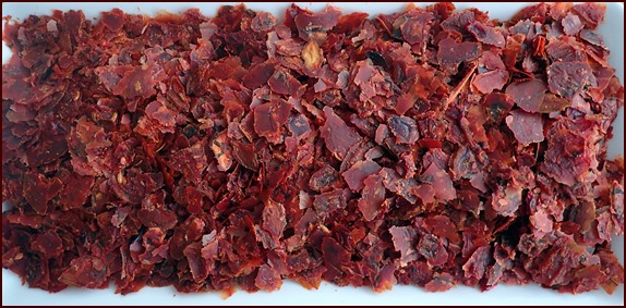 Dried ratatouille torn into pieces for packing.