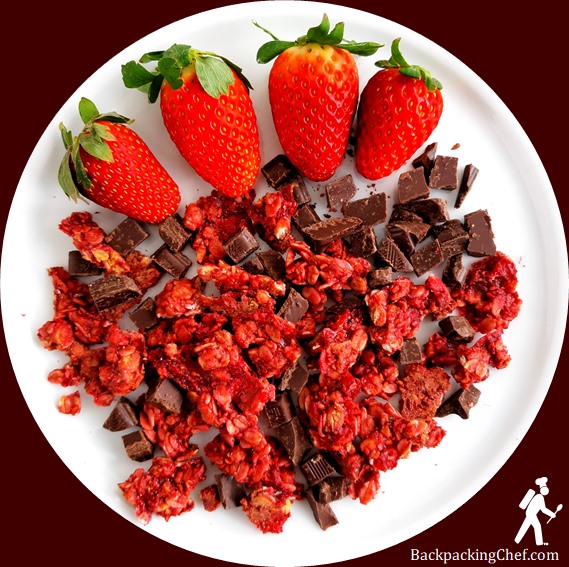Dehydrated strawberry-raspberry granola clusters