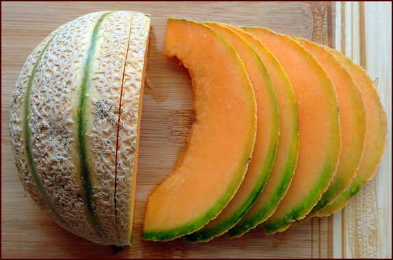 Cutting a cantaloupe for dehydrating.