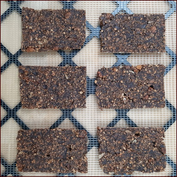 Energy bars drying on mesh sheets.