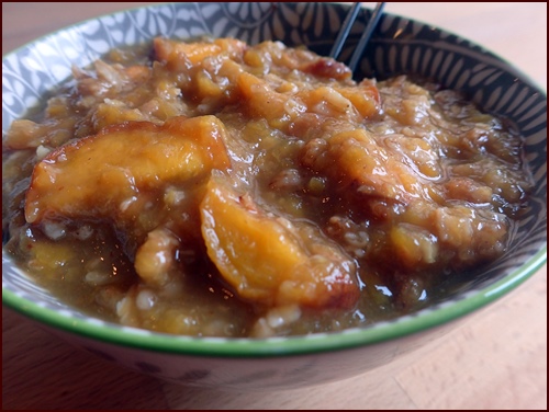 A delicious bowl of Hot Peach Crumble.