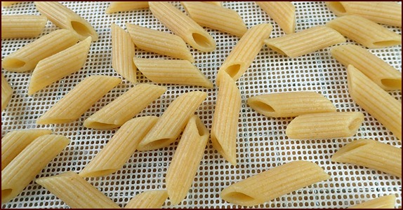Dehydrating penne pasta.