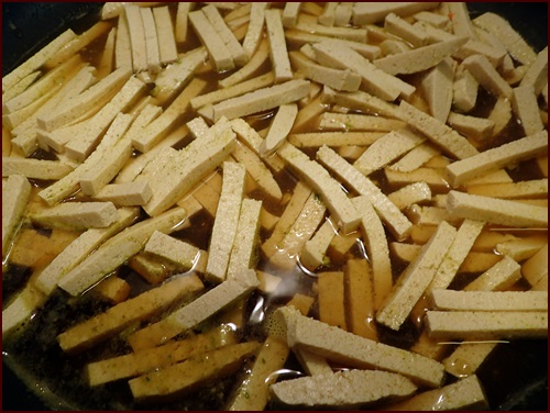 Tofu cut into noodle shapes, lightly seasoned and cooked in liquid before dehydrating.
