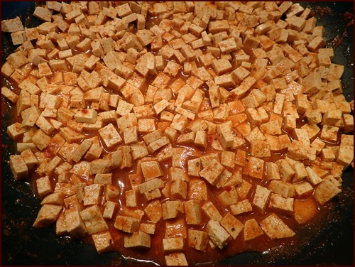 Tofu cut into small squares, seasoned with taco flavors.