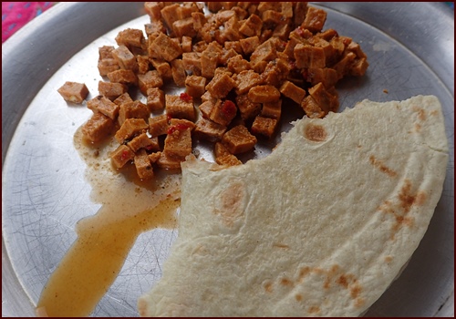 Square cut, taco-flavored dried tofu after rehydration. Enough for two tortillas.