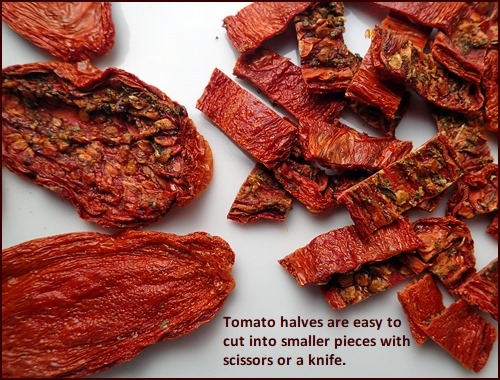 Dehydrated tomato jerky on left, cut into smaller pieced on right.