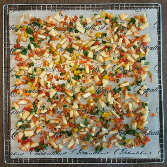 Two cups of salad on Excalibur dehydrator tray.