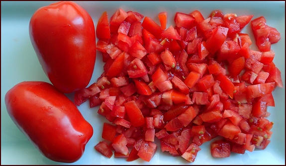 Diced tomatoes for mango salsa.