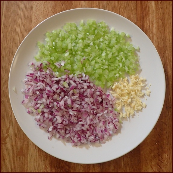 Finely chopped onions, celery, and garlic for stuffing.