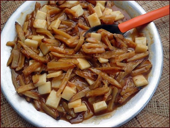 French fries & gravy with cheese. Called poutine in Canada when cheese curds are used.