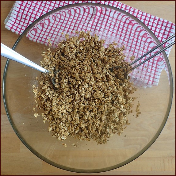 Mixing homemade granola ingredients.