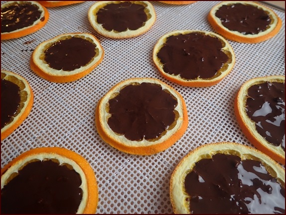 Orange slices after applying chocolate.