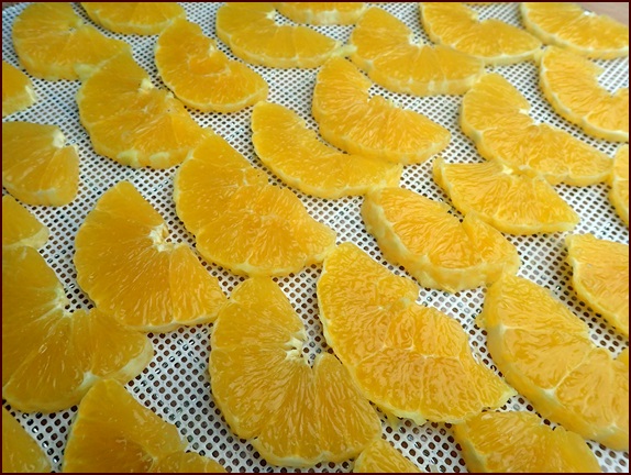 Orange Slices on a nonstick, silicone mesh sheet.