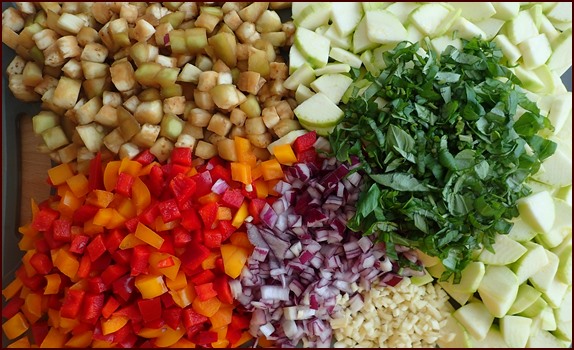 Ratatouille Ingredients: eggplant, zucchini, bell peppers, onions, garlic and basil.