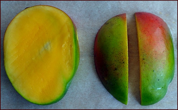 Photo shows a ripe mango ready for slicing and drying.