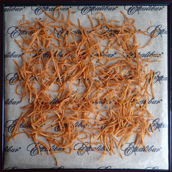 One serving of Thai peanut noodles on Excalibur dehydrator tray after drying.
