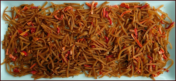 One serving of dehydrated Thai peanut noodles with dried carrots and red bell peppers.