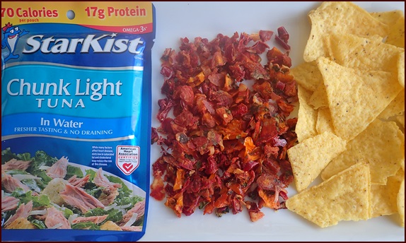 A pouch of tuna with rehydrated salsa and chips.