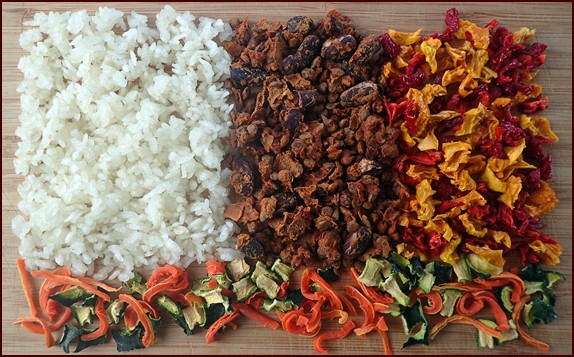 Dehydrated ingredients for Vegetarian Unstuffed Peppers. Green-Lentil Chili in center.