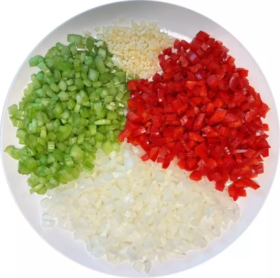 Diced onion, celery, red bell pepper, and minced garlic. Diced onion, celery, red bell pepper, and minced garlic.