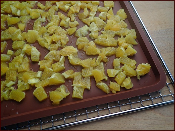 Dehydrating Orange Pieces. Dehydrating Orange Pieces.