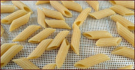 Dehydrating penne pasta.