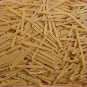 Fettuccine noodles before cooking. Fettuccine noodles before cooking.