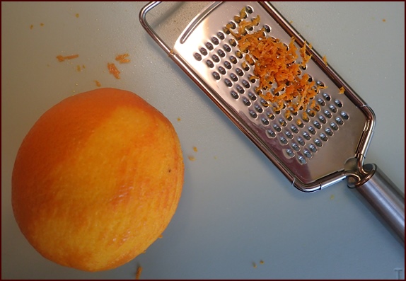 Grating the peel of one orange.