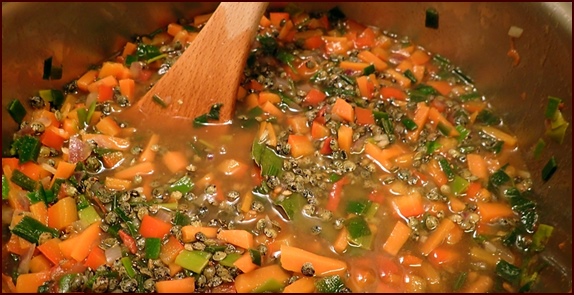 Cooking Green Lentil Stew.