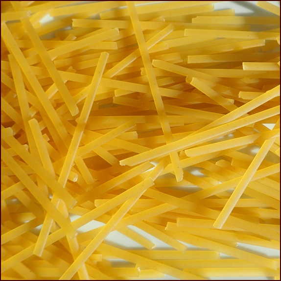 Linguini noodles broken into fourths before cooking.