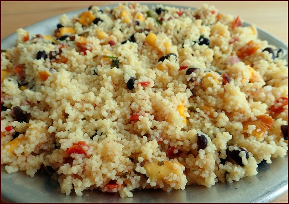 Photo shows Mango Salsa Couscous Salad rehydrated in a thermos food jar.