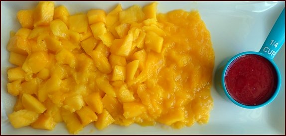 Photo shows mango with seedless raspberry juice. You’ll need about 30 grams of raspberries to make 2 tablespoons of seedless raspberry juice.