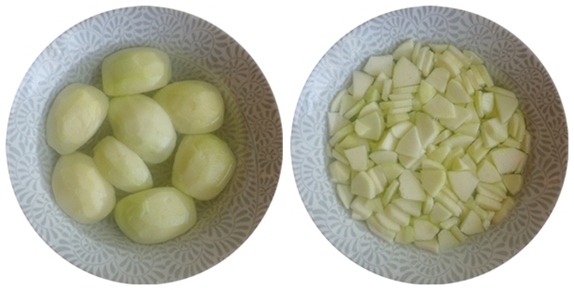 Two peeled and quartered apples in soaking solution on left, cut into slices on right.