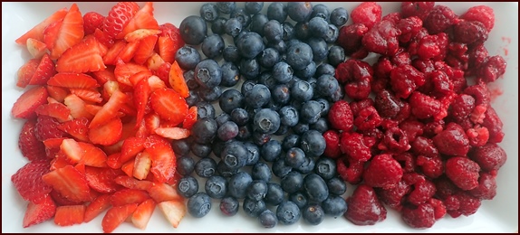 Strawberries, blueberries, and raspberies for dehydrating fruit leather.