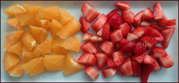 Oranges and strawberries for making fruit leather.