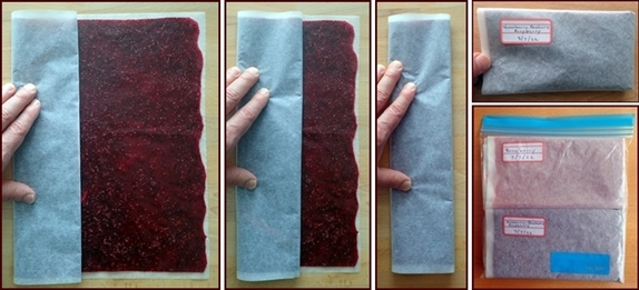 Packing fruit leather by folding it in baking paper.