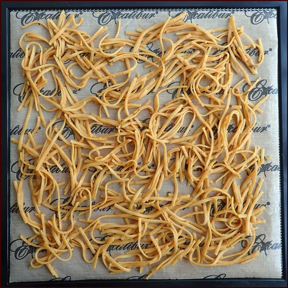 One serving of Thai peanut noodles on Excalibur dehydrator tray before drying.