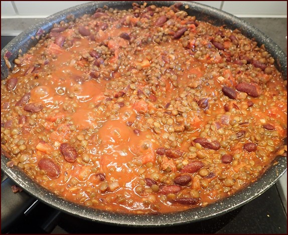 Cooking green-lentil chili.